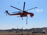 N179AC @ POC - On lift off, aircraft delivers a 100 mph wind, notice debris airbourne caused by take off thrust of the main rotors - by Helicopterfriend