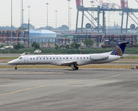 N13903 @ KEWR - This regional jet appears to be dwarfed by all the industrial equipment of Port Elizabeth in the background. - by Daniel L. Berek