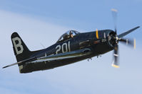 G-RUMM @ EGSU - At Flying Legends 2012. Stephen Grey flying his Bearcat. - by Howard J Curtis