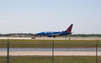 N711SY @ RSW - 737 clear for take off RWY 6 - by Mauricio Morro