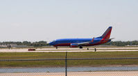 N372SW @ RSW - 737 taking off - by Mauricio Morro