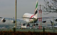 A6-EDR @ EGLL - Emirates Airlines, (A6-EDR) 2011 Airbus A380-861, c/n 083, on approach to land on 27L with another (A6-EEA) pushing to take off on 27R Heathrow. © PhilRHama - by Phil R Hamar