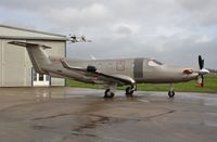 LX-JFK @ EGHH - Facing the gales at Pilatus Centre - by John Coates