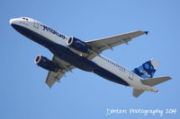 N625JB @ KSRQ - JetBlue Flight 164 (N625JB) Company Blue departs Sarasota-Bradenton Interantional Airport enroute to John F Kennedy International Airport - by Donten Photography