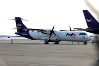 N802FX @ KCID - At the FedEx ramp, photographed through a chain-link fence - by Glenn E. Chatfield