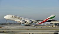 A6-EEP @ KLAX - Departing LAX on 25L - by Todd Royer