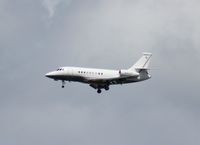 N904TF @ MCO - Falcon 2000EX - by Florida Metal