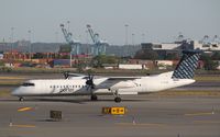 C-GLQO @ KEWR - DHC-8-402Q - by Mark Pasqualino