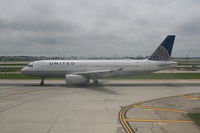 N442UA @ KORD - Taxiing on runway - by Daniel Vanderauwera