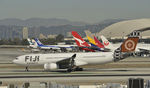 DQ-FJU @ KLAX - Taxiing to gate at LAX - by Todd Royer