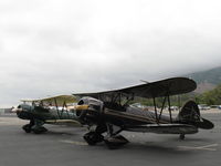 N110AS @ SZP - A pair of WACO Classic YMF-F5Cs parked on the transient line on First Sunday Aviation Museum of Santa Paula Open House & Fly-In. N110AS & N196RB. - by Doug Robertson