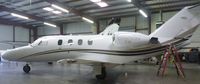 UNKNOWN @ KRHV - A rare and local Cessna Citation jet 1 is the only locally based airplane inside the Lafferty Aircraft Sales hangar. - by Chris L.