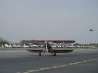 N32135 @ SZP - 1941 Waco UPF-7 classic biplane, Continental W670 220 Hp radial, taxi to Rwy 22 - by Doug Robertson