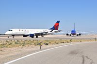 N252SY @ KBOI - Turning onto RWY 28R from Alpha with N252WN right behind. - by Gerald Howard