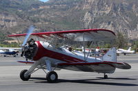 N32135 @ SZP - 1941 Waco UPF-7, Continental W670 220 Hp radial, chromed prop & spinner, S-turns taxi to Rwy 22 - by Doug Robertson
