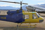 ZK-HUE @ NZWF - Stdb side view of the front end of Bell UH-1E ZK-HUE Cn 6045 at Wanaka NZWF on 21Apr2014, during Warbirds Over Wanaka (WOW) 2014. ZK-HUE wears a distinctive Blue/Yellow livery, for sponsor: ‘NZ Automobile Association’. - by Walnaus47