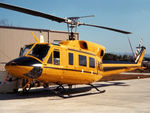 VH-NSC @ YLTV - Front Port side view of parked NSCA Bell 212 Helicopter VH-NSC Cn 30524, at Morwell - Melbourne Latrobe Valley Airport (YLTV) on 30Dec1982. (Later Sold to Canada as C-FNSA.) - by Walnaus47