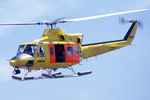 VH-NSO @ YSFS - Front Port side view of NSCA Bell 412 VH-NSO Cn 33089 Code 11 flying past at Schofields/ NAS Nirimba (YSFS) on 10Nov1985. The helo is equipped with pop-out floats and a Nite-Sun searchlight. (Helo with NSCA 08MAR85 - 29MAY89 - later Sold to USA as N167EH. - by Walnaus47
