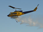 N234PH @ YBUD - Portside view of McDermott Aviation Bell 214B-1 Biglifter N234PH Cn 28050 flypast ‘water-dump’ at Bundaberg Airshow at Bundaberg Airport YBUD on 17Jul2005. Equipped with ‘under-cabin’ water tank, with ‘pick-up’ hose extended. - by Walnaus47