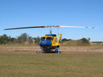 N234PH @ YBUD - Front view of McDermott Aviation Bell 214B-1 Biglifter N234PH Cn 28050 parked at Bundaberg Airshow at Bundaberg Airport YBUD on 16Jul2005. Equipped with ‘under-cabin’ water tank, with ‘pick-up’ hose retracted. - by Walnaus47