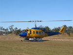 N234PH @ YBUD - Front Portside view of McDermott Aviation Bell 214B-1 Biglifter N234PH Cn 28050 parked at Bundaberg Airshow at Bundaberg Airport YBUD on 17Jul2005. Equipped with ‘under-cabin’ water tank, with ‘pick-up’ hose retracted. - by Walnaus47