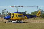 N234PH @ YBUD - Close cropped Front Portside view of McDermott Aviation Bell 214B-1 Biglifter N234PH Cn 28050 parked at Bundaberg Airshow at Bundaberg Airport YBUD on 16Jul2005. Equipped with ‘under-cabin’ water tank, with ‘pick-up’ hose retracted. - by Walnaus47