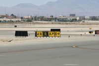  @ North Las Vegas Airport - Funny direction/location sign - by slushie