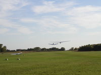  - 312RA towing 6156J off of Runway 20 at Faribault. - by Mitch Sando