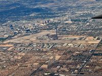  - A view of McCarran while heading east. KVGT, also known as North Las Vegas Air Terminal can be seen towards center top. - by Brad Campbell