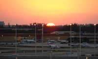  - The sunsets over the busy FBO during Miami Boat Show Week - by Terry Fletcher