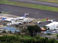  @ Cairns International Airport - View of the Cargo ramp from the adjacent Mountain park - by Terry Fletcher
