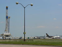  - Gas well drilling rig near UPS ramp - by Zane Adams