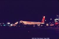  - Qantas B707 being fueled and catered in HKG Kai Tak in 1968 for late departure - by metricbolt