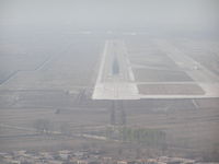  - Runway 31 at Taiyuan PRC, ZBYN/TYN. Haze/smog keeps vis low. - by John J. Boling