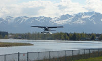  @ Lake Hood Seaplane Base - A DHC2 Beaver takes off from Spenard Lake end against a beautiful backdrop - by Terry Fletcher