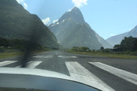  - lined up for 29 departure from Milford Sound in Ce206 ZK-RLM, ZK-LAW departing ahead - by Pete Hughes