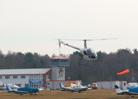  - LOOKING FROM THE AIRFIELD NORTH SIDE TOWARDS THE TERMINAL WITH ROLLASON R22 G-BZYE DEPARTING NORTH - by BIKE PILOT