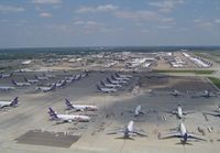  - Amazing sight of part of the extensive Fedex ramp containing over 100 aircraft (A300-600,A310,MD11,DC10,B727 and ATR42), taken whilst on approach to 18R. Later that Afternoon a mass departure of 80 of these aircraft left in just 90 minutes, also visible i - by keith sowter