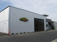  - New Hangar Under Construction-new plants at base of hangar wall. - by Doug Robertson
