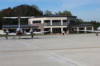  - Nice new FBO facility and ramp on the far west end of the field. - by Bob Simmermon