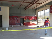  - 32 Curtiss Taxi-New hangar under construction. Matching red full kitchen cabinets in installation. - by Doug Robertson