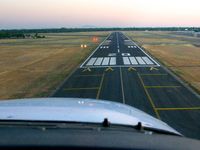  - Short final, runway 20. - by Chris Saulit