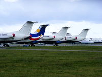  - Embraer ERJ-145's and BAe 146's in storage at Exeter Airport - by Chris Hall