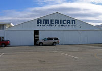  - American Aircraft Sales hangar at Hayward Air Terminal, CA hasn't changed much since 1966 when I photographed several of Mike Coutches P-51Ds being converted for civilian use and the California ANG 129 ACS operated special forces C-119s and U-10A Couriers - by Steve Nation