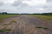  - Runway at 'Eua, terminal to the left - by Micha Lueck