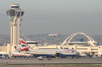  - BA 744 taxiing out on the south complex with a VA A320 landing on the north side. - by Mark Kalfas