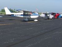  - Lined up on the ramp (Cessna, Carlson, Taylorcraft, Grand Funk) at the EAA breakfast fly-in. - by Bob Simmermon