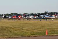  - Lining up to depart Airventure 2011. - by Bob Simmermon
