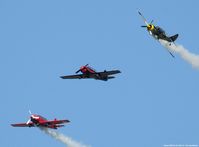  - Yak-52s breaking over Easton MD - by J.G. Handelman