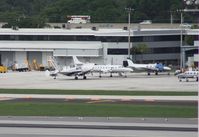  - Mix of planes on the GA ramp including a Metro and a Beech 18 - by Florida Metal
